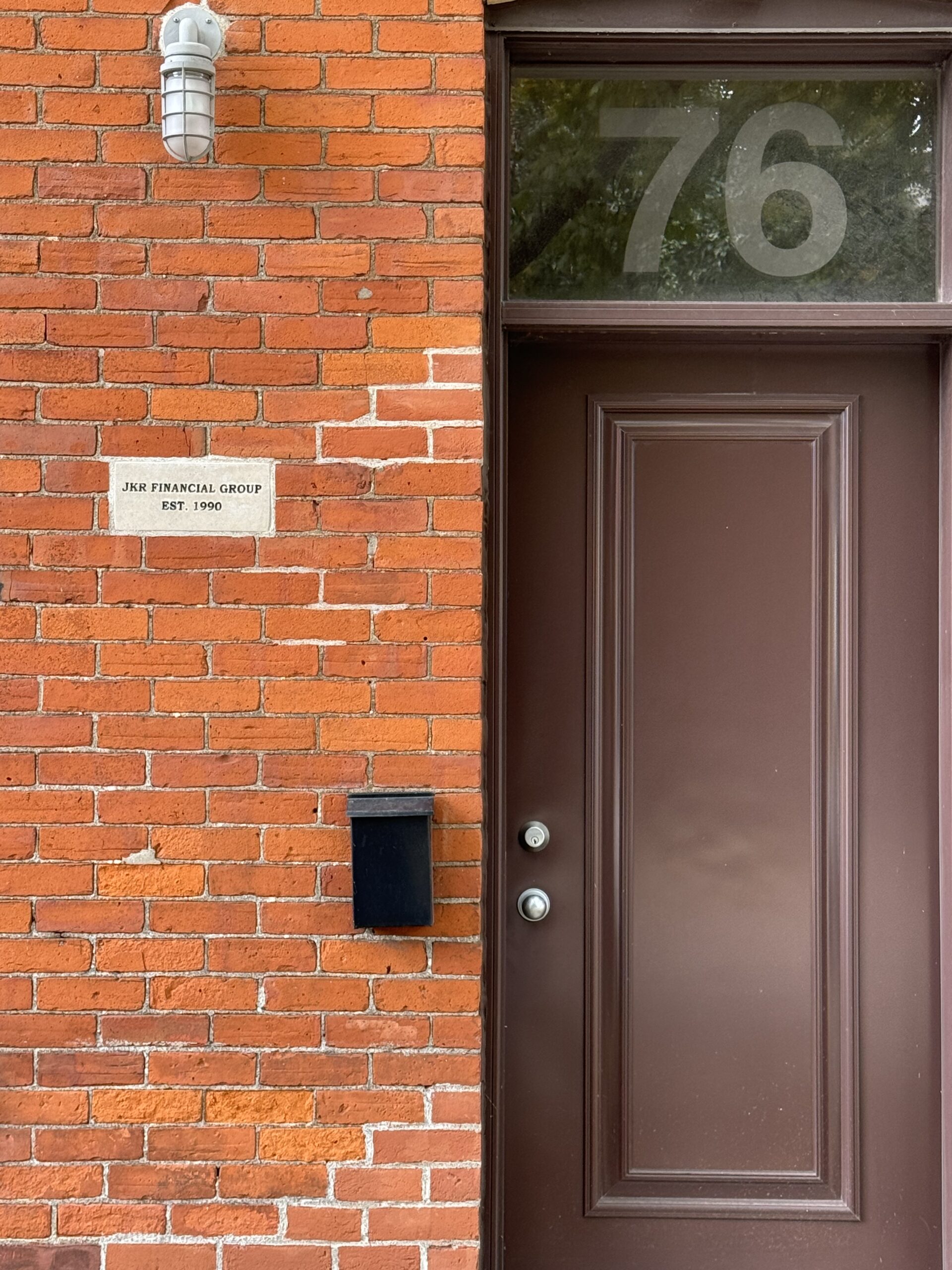 The brown front door at 76 Walnut Street South, Hamilton